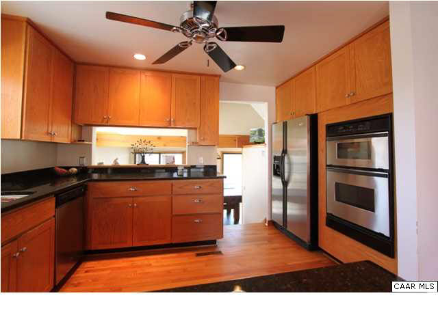 2525 Ridge Road Charlottesville, VA 22901 - Photo 5 of 33 a kitchen with stainless steel appliances kitchen island granite countertop a refrigerator a stove top oven a sink and dishwasher