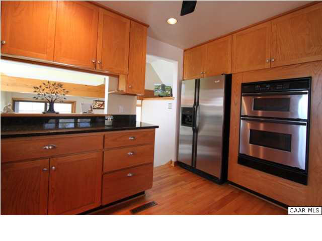 2525 Ridge Road Charlottesville, VA 22901 - Photo 6 of 33 a kitchen with stainless steel appliances granite countertop a refrigerator a stove a sink and a microwave