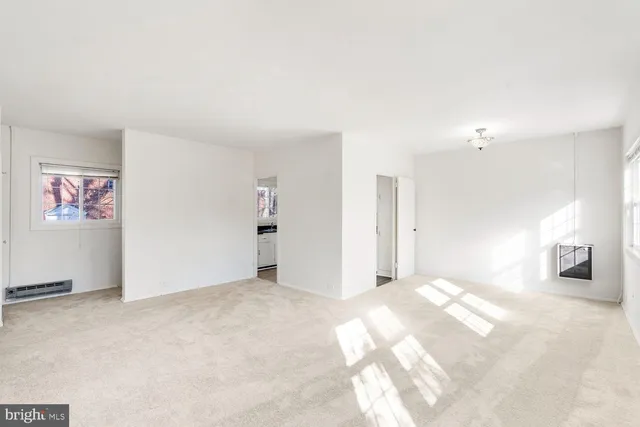 a view of an empty room with a window