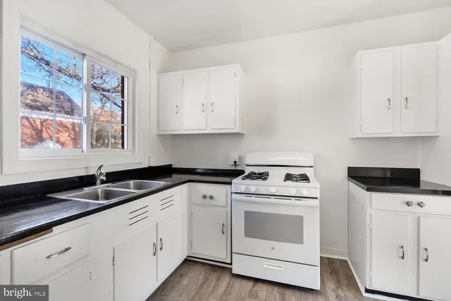 a view of a kitchen from a hallway