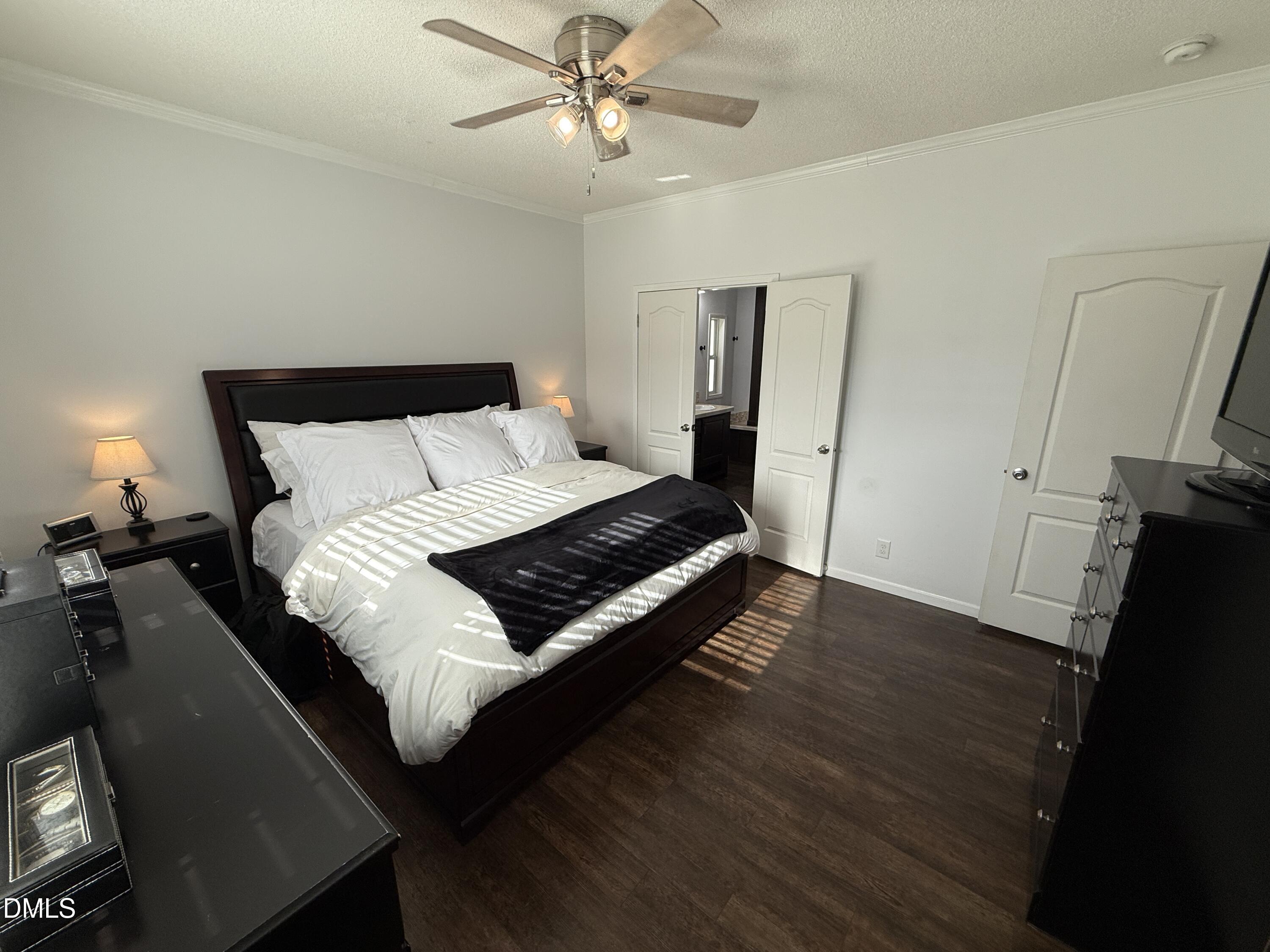 11242 Bissette Road Middlesex, NC 27557 - Photo 15 of 49 a bed sitting in a bedroom next to a window