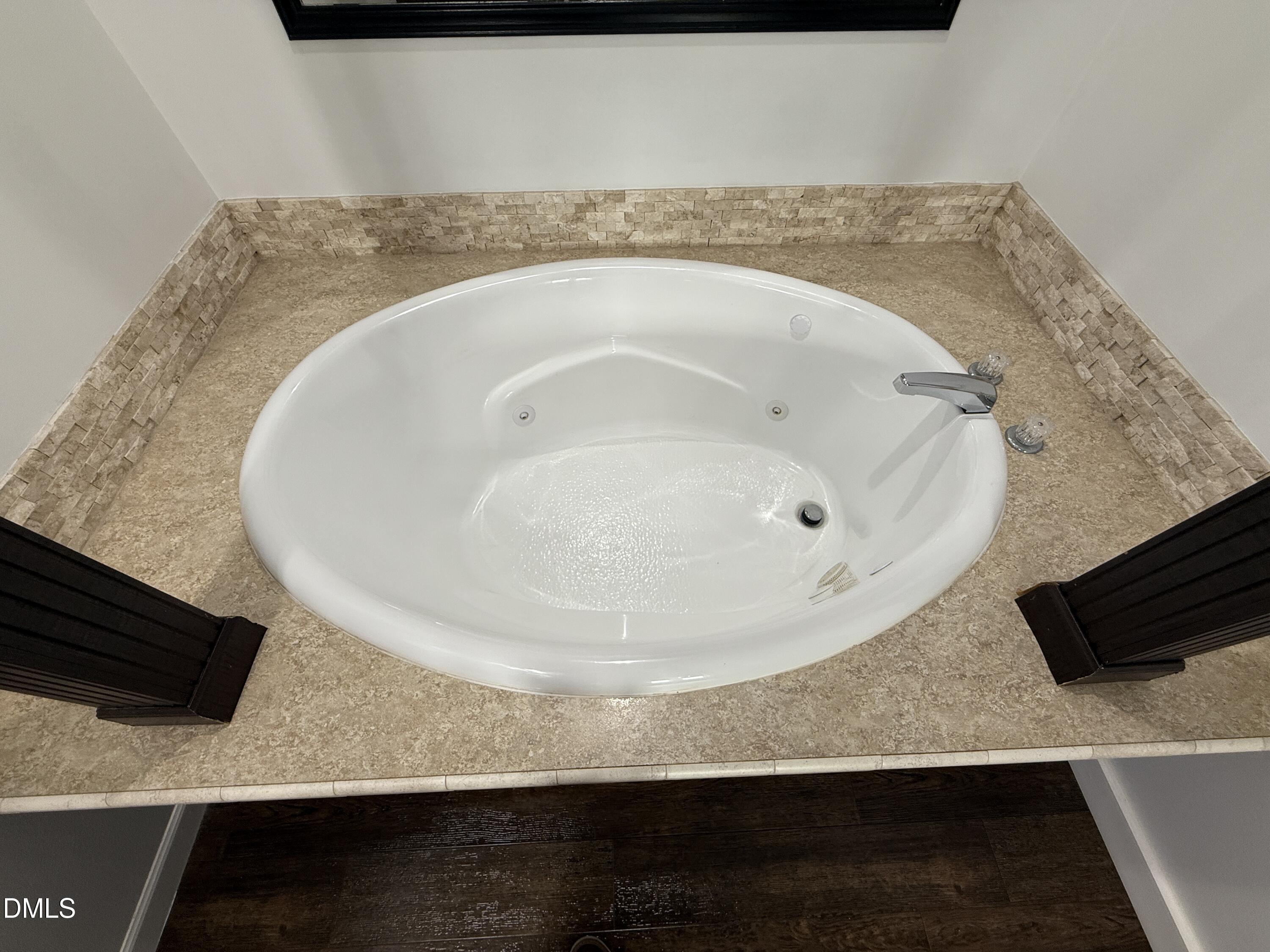 11242 Bissette Road Middlesex, NC 27557 - Photo 20 of 49 a bathroom with a sink and a mirror