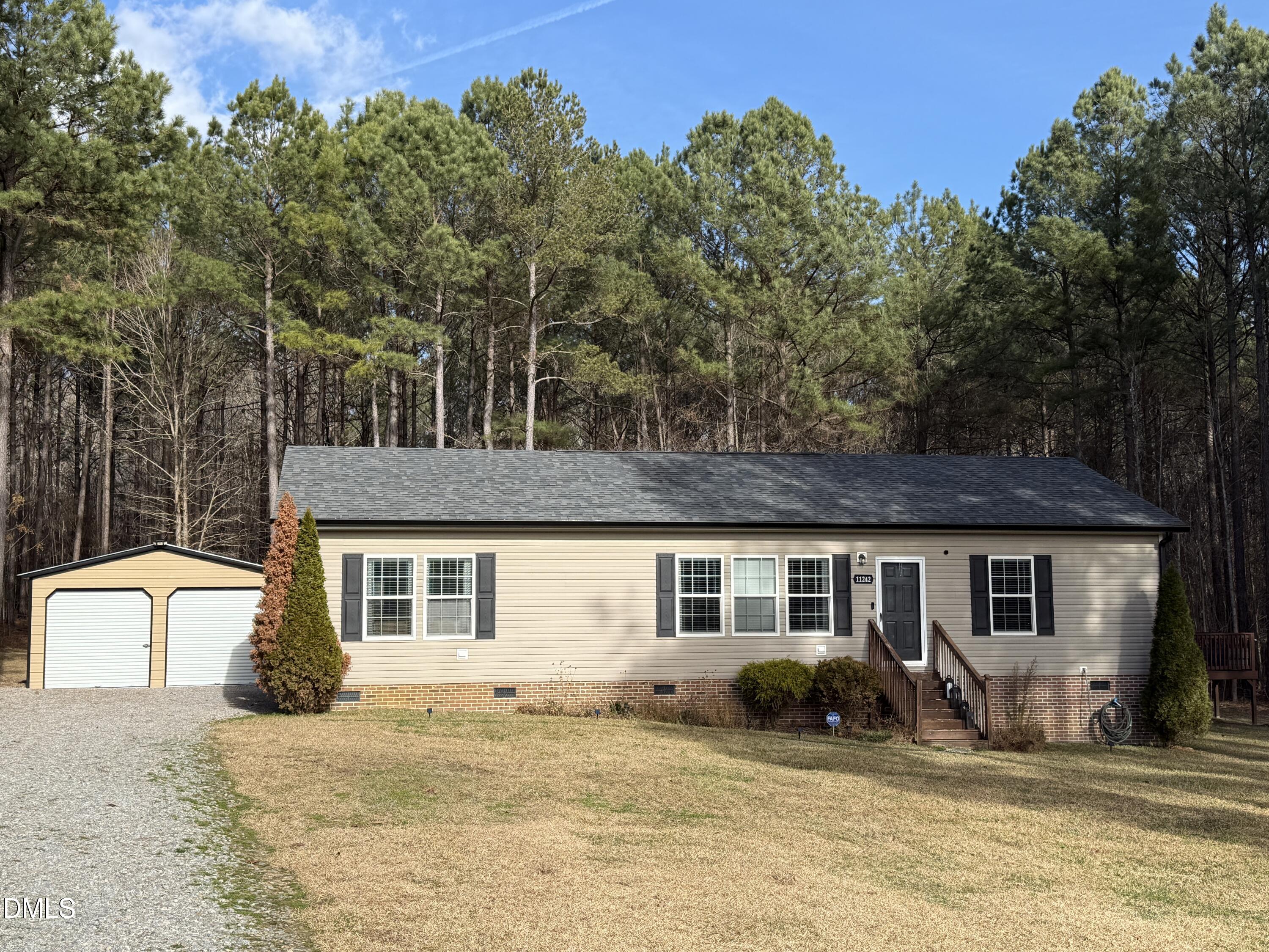11242 Bissette Road Middlesex, NC 27557 - Photo 2 of 49 a front view of a house with a yard