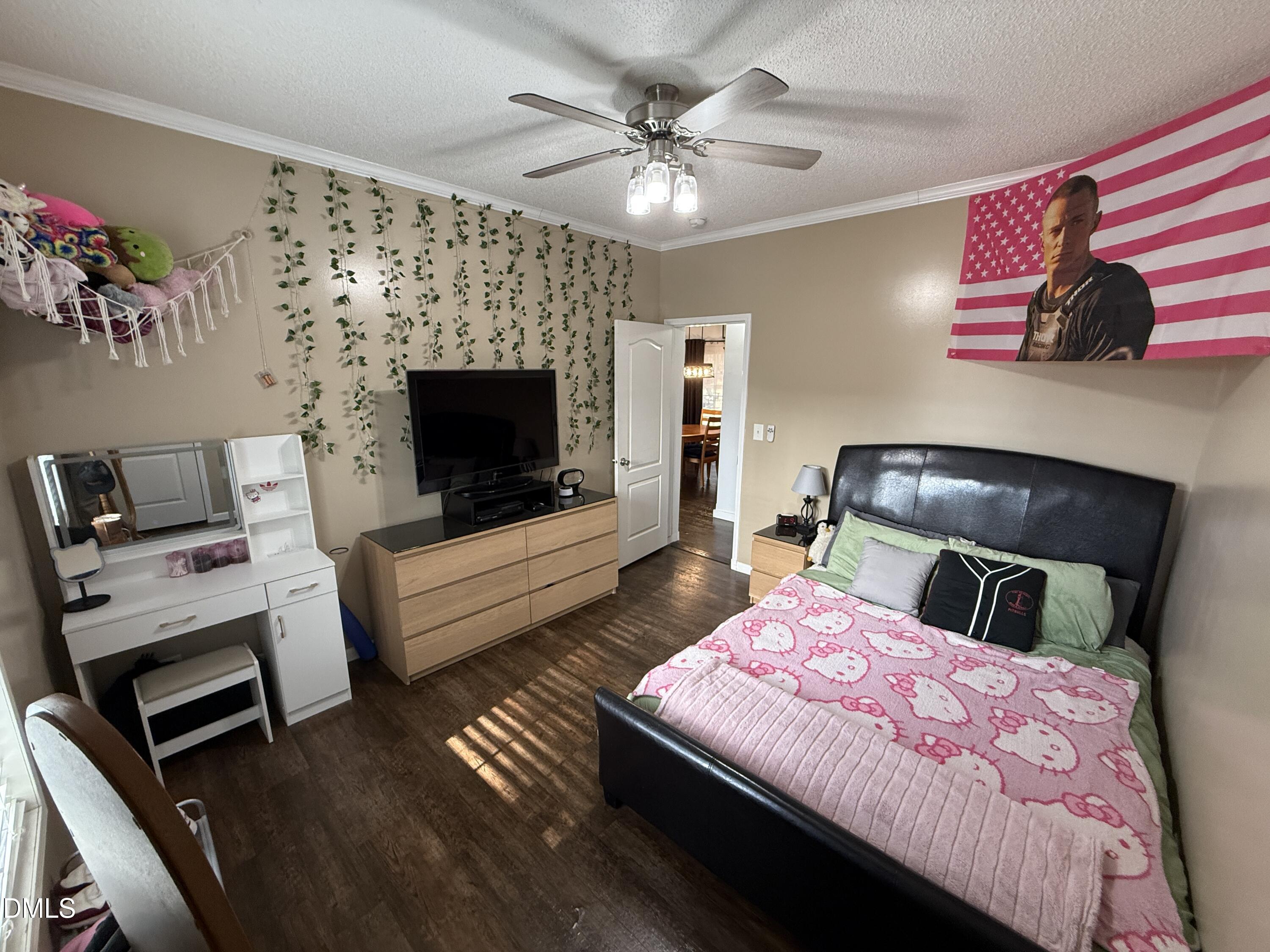 11242 Bissette Road Middlesex, NC 27557 - Photo 23 of 49 a bedroom with a bed and a fireplace