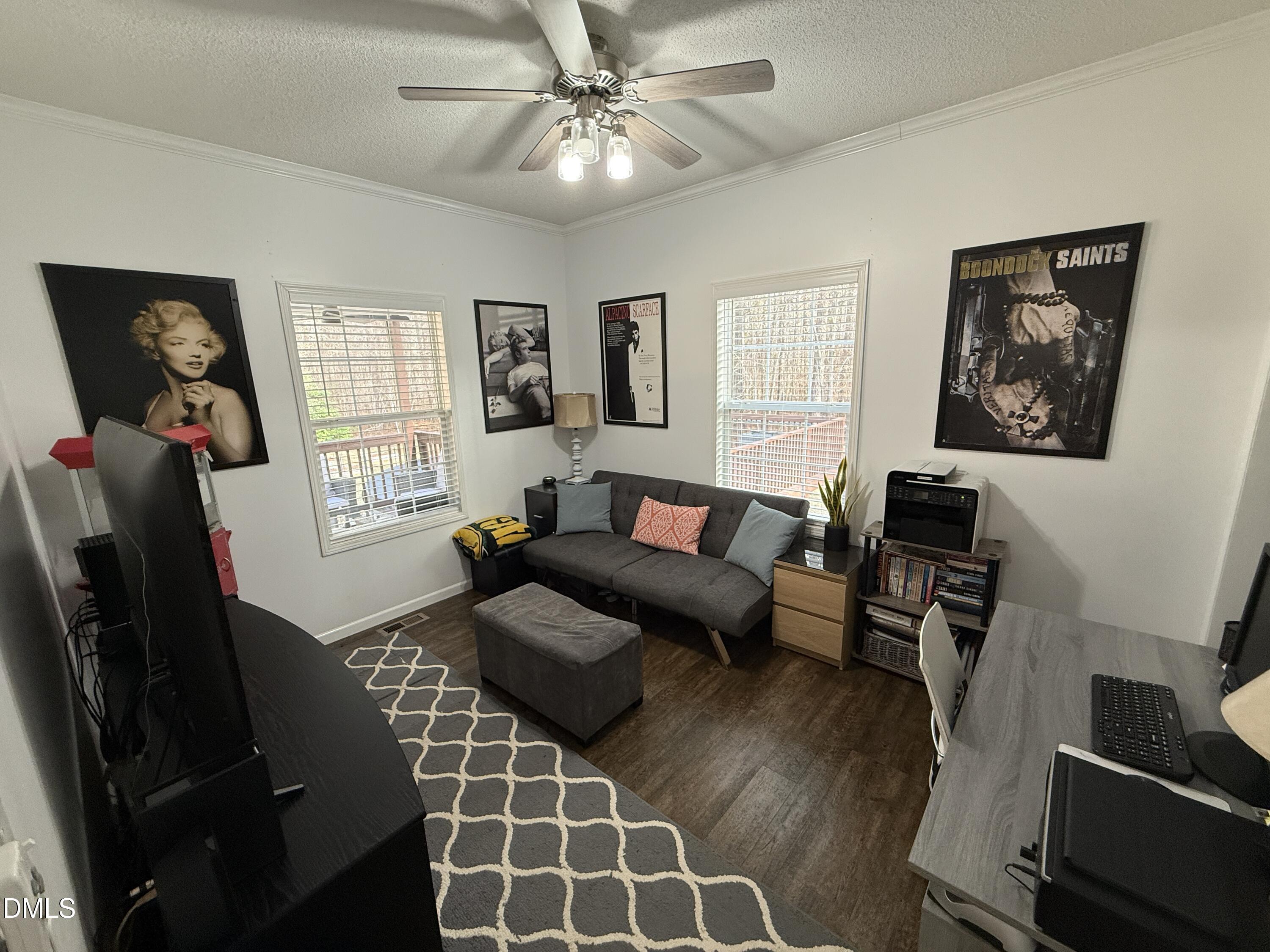 11242 Bissette Road Middlesex, NC 27557 - Photo 26 of 49 a living room with furniture a flat screen tv and a window