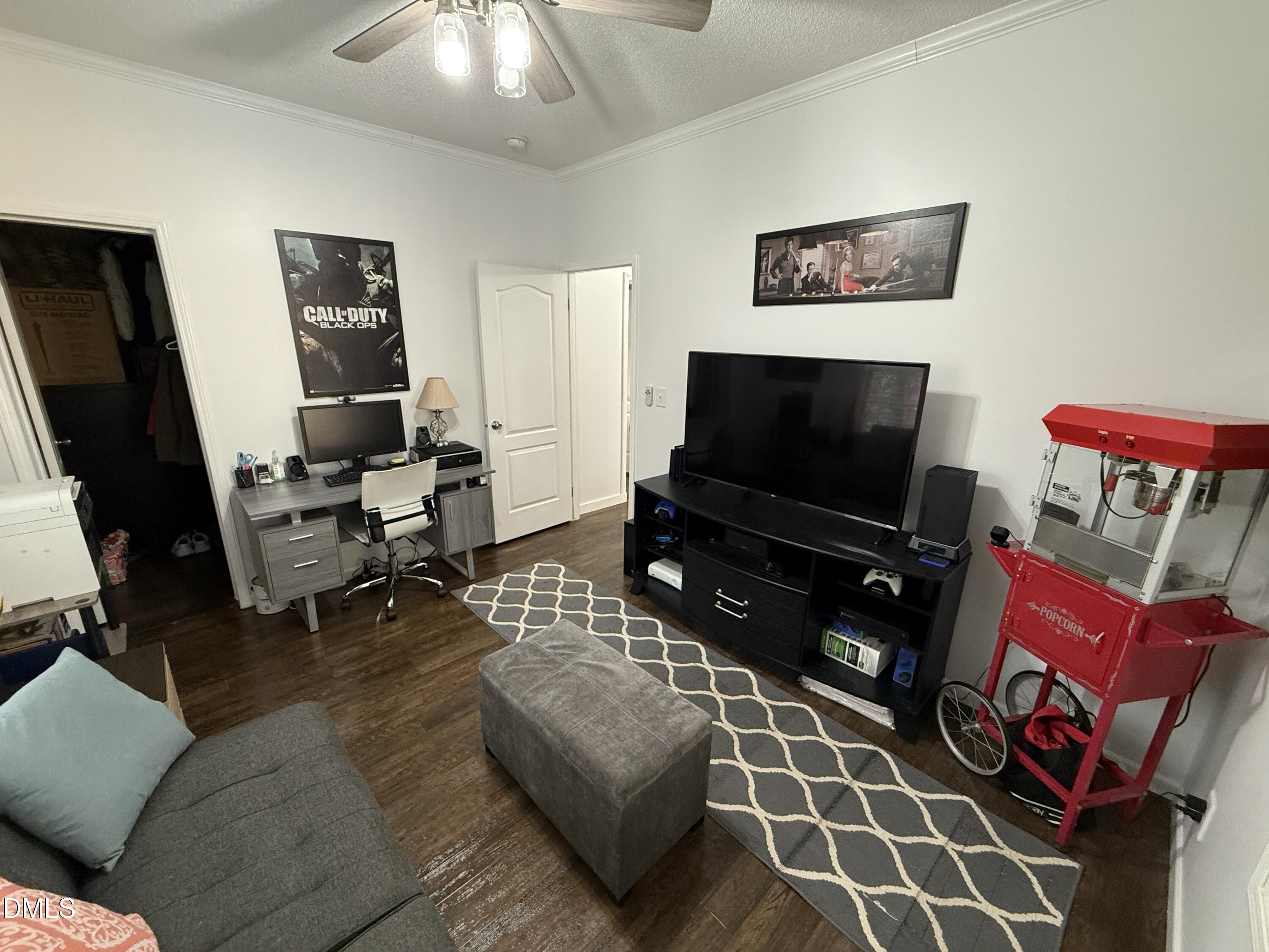 11242 Bissette Road Middlesex, NC 27557 - Photo 28 of 49 a living room with furniture and a flat screen tv