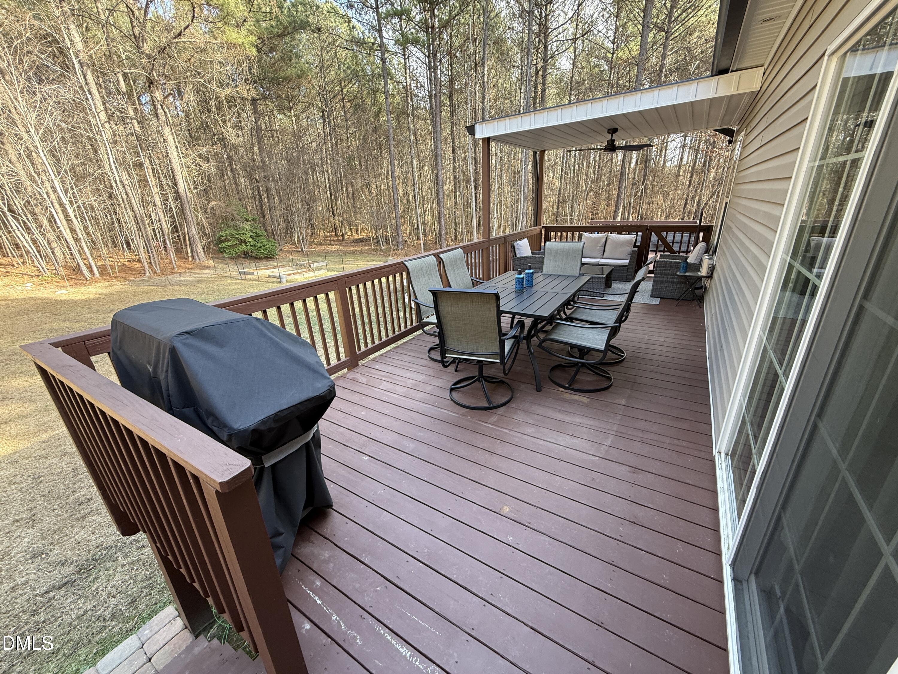 11242 Bissette Road Middlesex, NC 27557 - Photo 31 of 49 a roof deck with wooden floor table and chairs