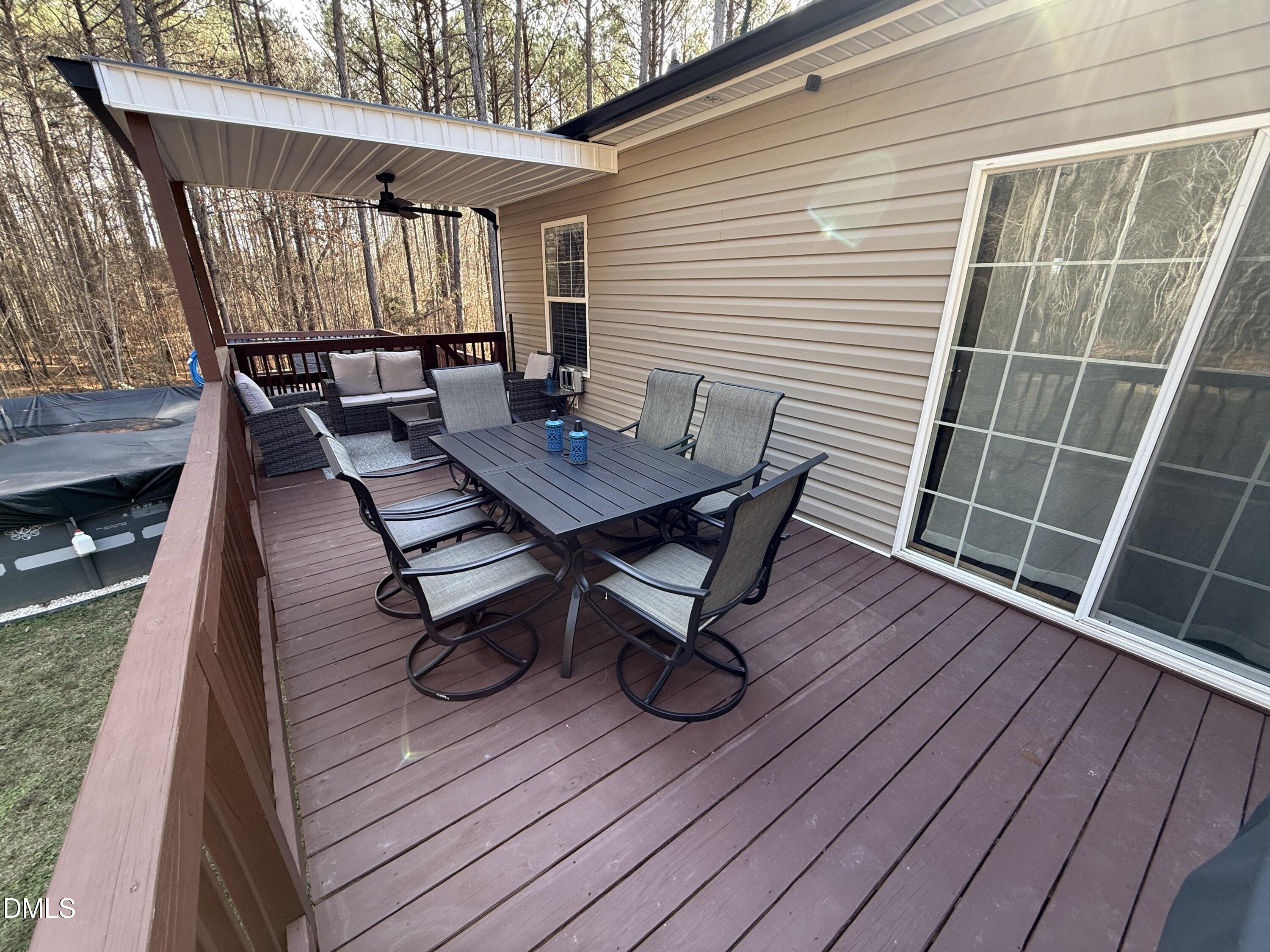 11242 Bissette Road Middlesex, NC 27557 - Photo 32 of 49 a roof deck with wooden floor and fence
