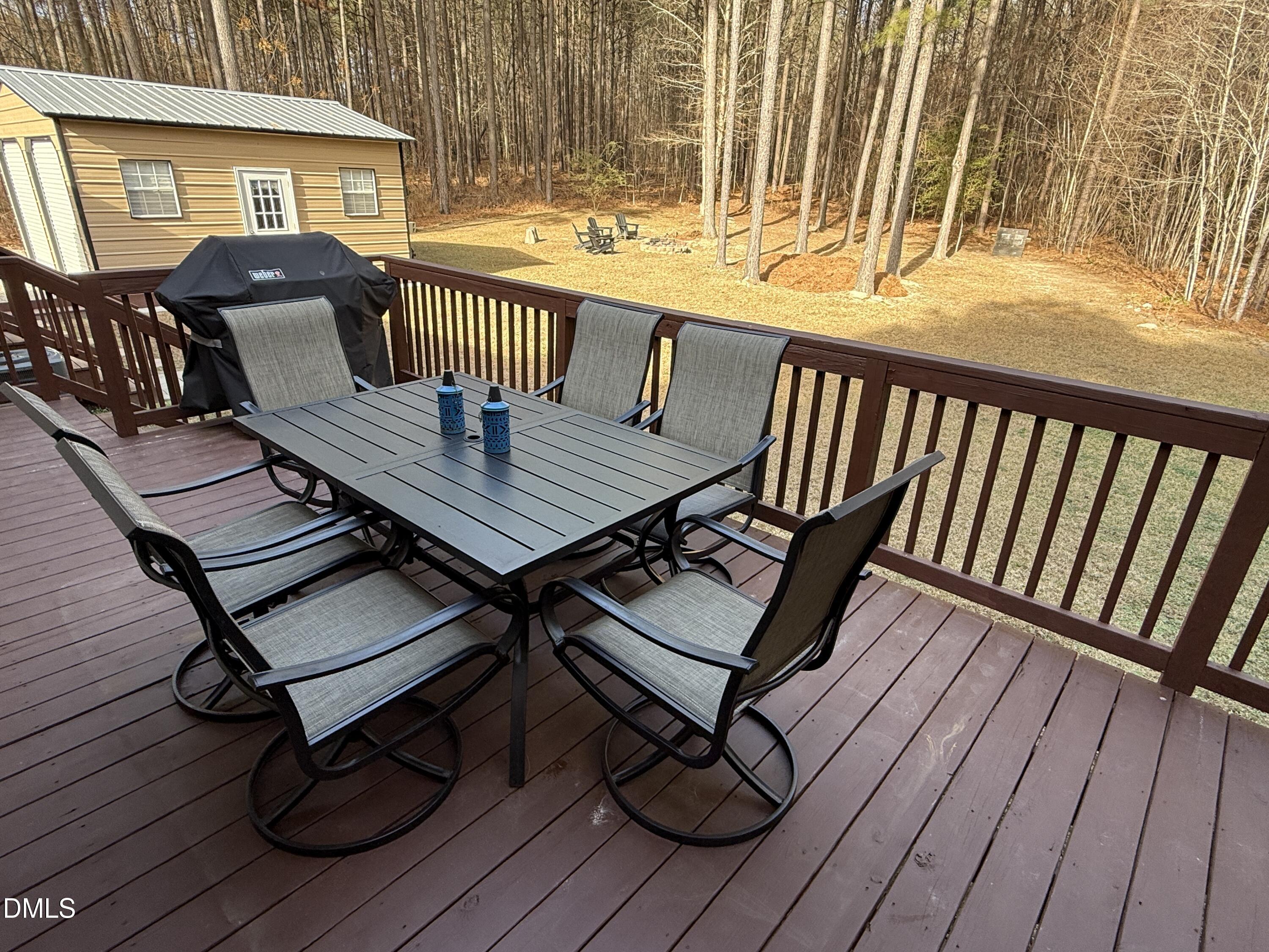 11242 Bissette Road Middlesex, NC 27557 - Photo 33 of 49 a view of a chairs and table on the deck