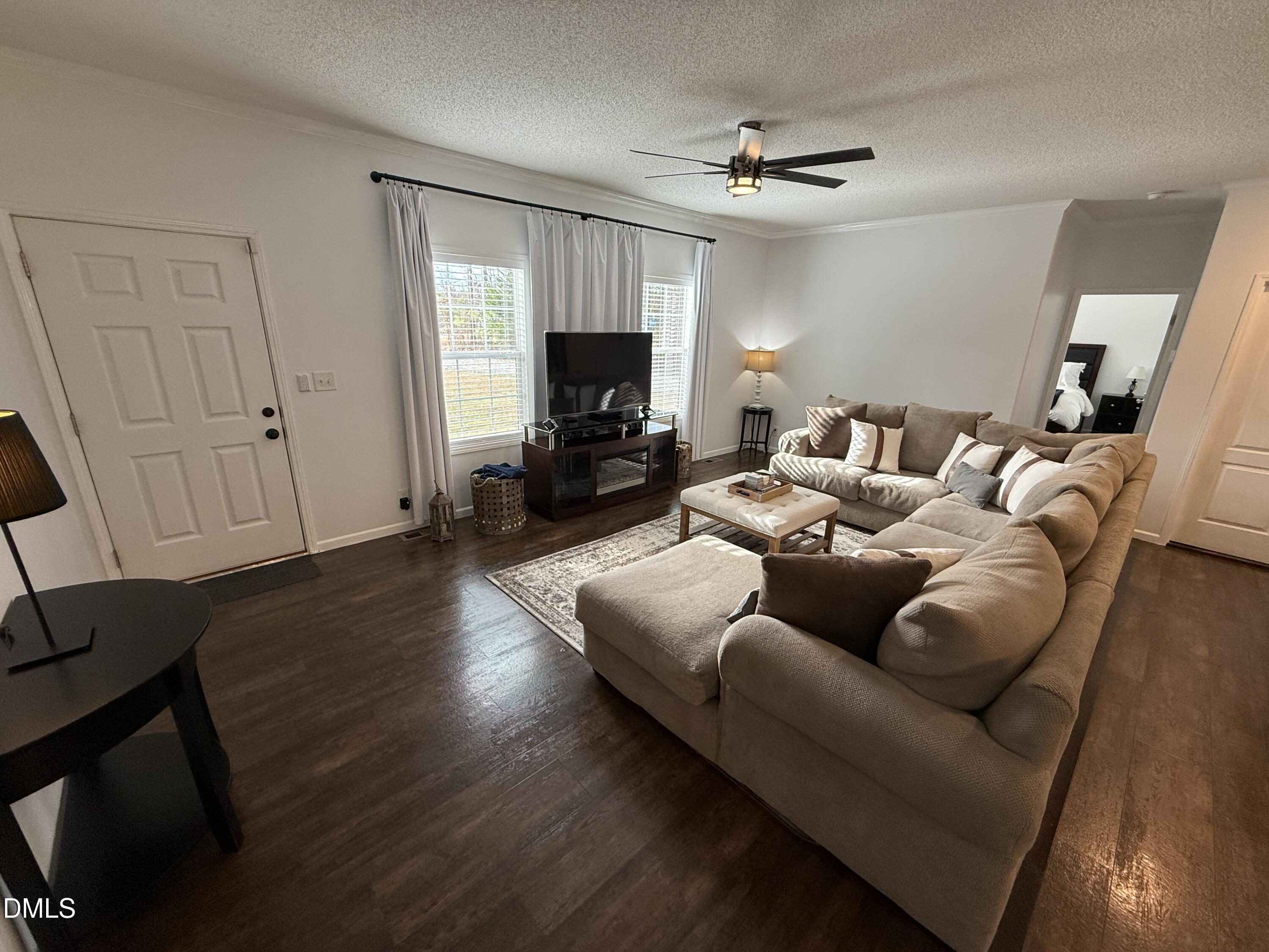 11242 Bissette Road Middlesex, NC 27557 - Photo 5 of 49 a living room with furniture and a flat screen tv
