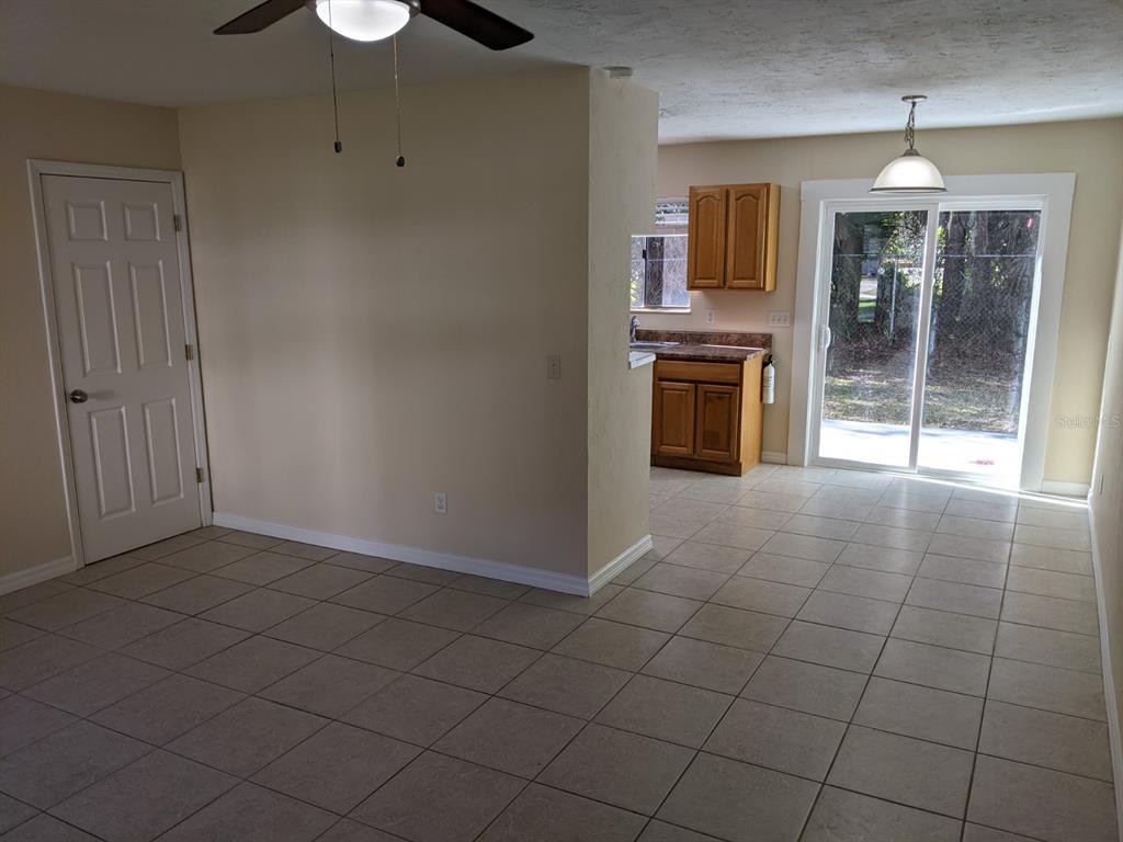 322 Canal Road, Unit D26 Edgewater, FL 32132 - Photo 2 of 9 a view of a kitchen with furniture and an empty room