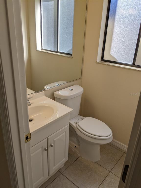 322 Canal Road, Unit D26 Edgewater, FL 32132 - Photo 6 of 9 a white toilet sitting next to a bathroom sink