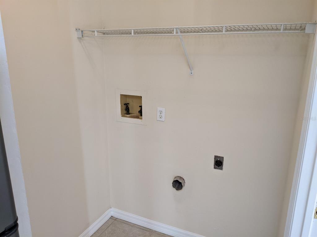 322 Canal Road, Unit D26 Edgewater, FL 32132 - Photo 7 of 9 a bathroom with a shower