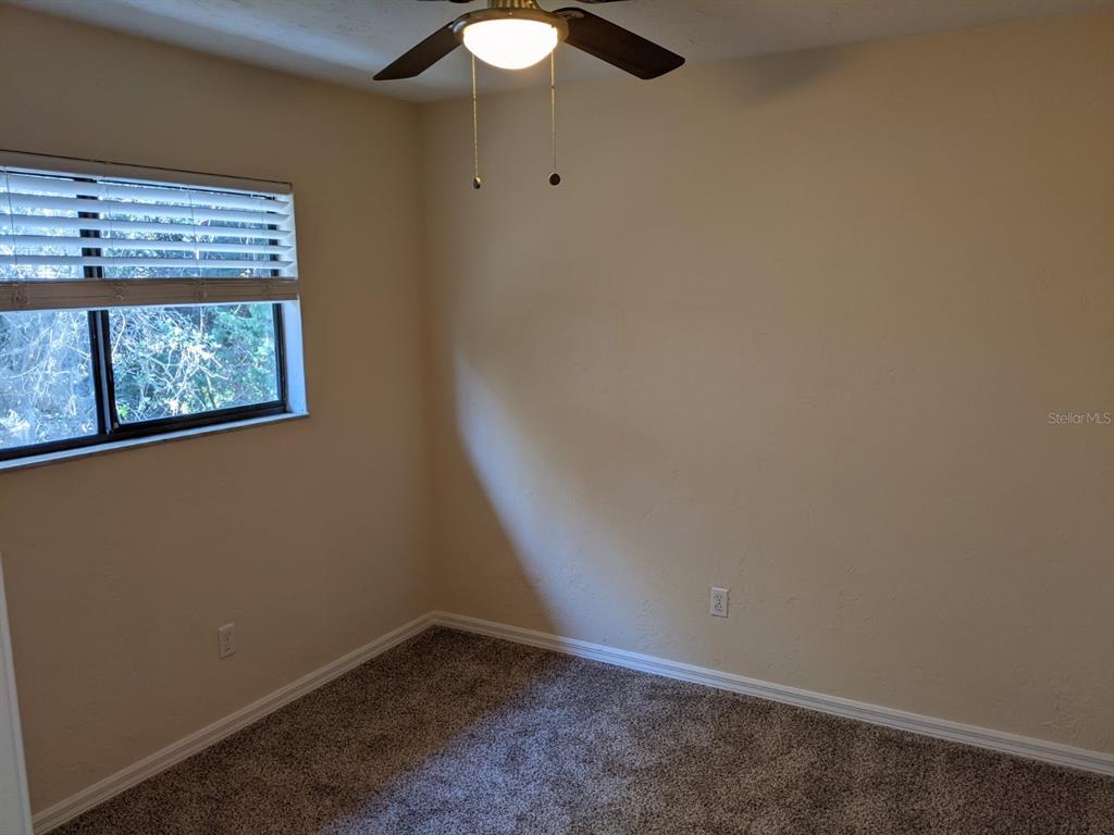 322 Canal Road, Unit D26 Edgewater, FL 32132 - Photo 8 of 9 an empty room with windows