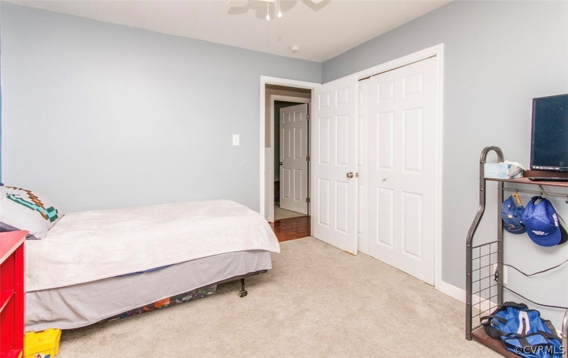 12906 Lewis Road Chesterfield, VA 23831 - Photo 13 of 22 a bedroom with a bed and a mirror