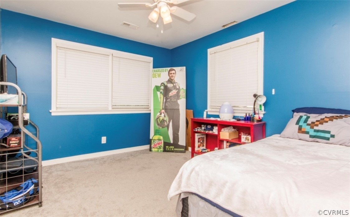 12906 Lewis Road Chesterfield, VA 23831 - Photo 14 of 22 a bedroom with a bed and a chandelier