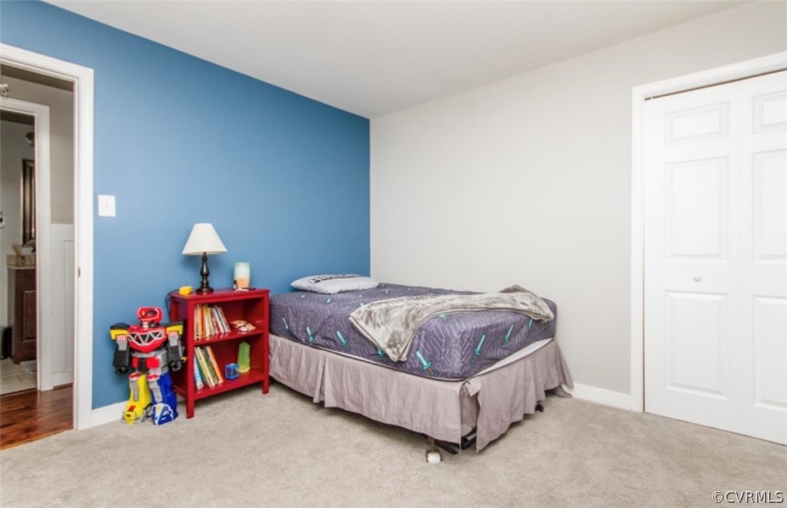 12906 Lewis Road Chesterfield, VA 23831 - Photo 17 of 22 a bedroom with a bed and a window