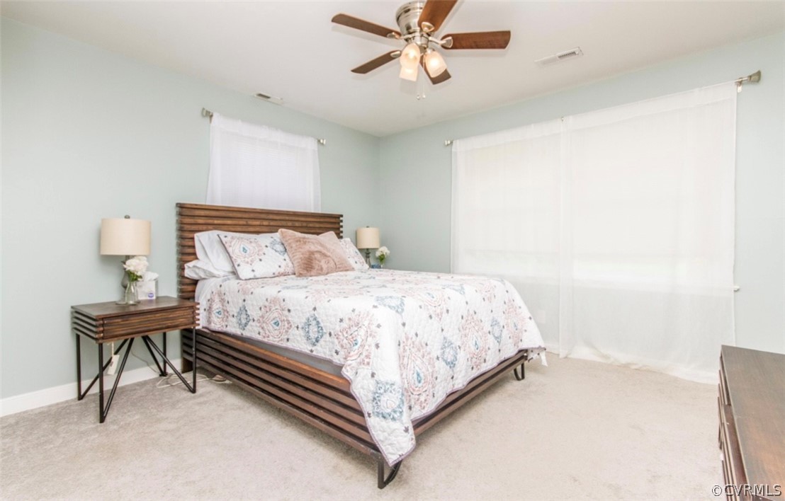 12906 Lewis Road Chesterfield, VA 23831 - Photo 19 of 22 a bedroom with a bed and a table