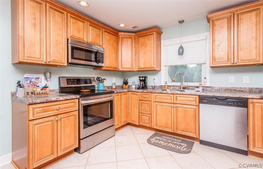 12906 Lewis Road Chesterfield, VA 23831 - Photo 2 of 22 a kitchen with stainless steel appliances granite countertop a stove sink microwave and cabinets