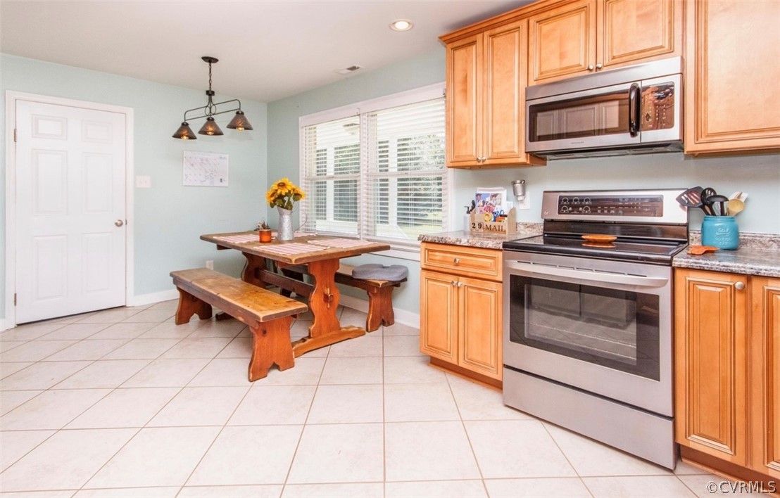 12906 Lewis Road Chesterfield, VA 23831 - Photo 3 of 22 a kitchen with stainless steel appliances granite countertop a stove a sink and a microwave