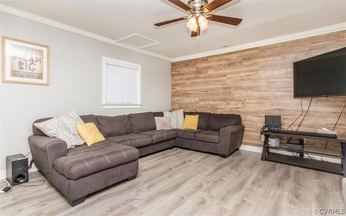 12906 Lewis Road Chesterfield, VA 23831 - Photo 7 of 22 a living room with furniture a flat screen tv and a fireplace