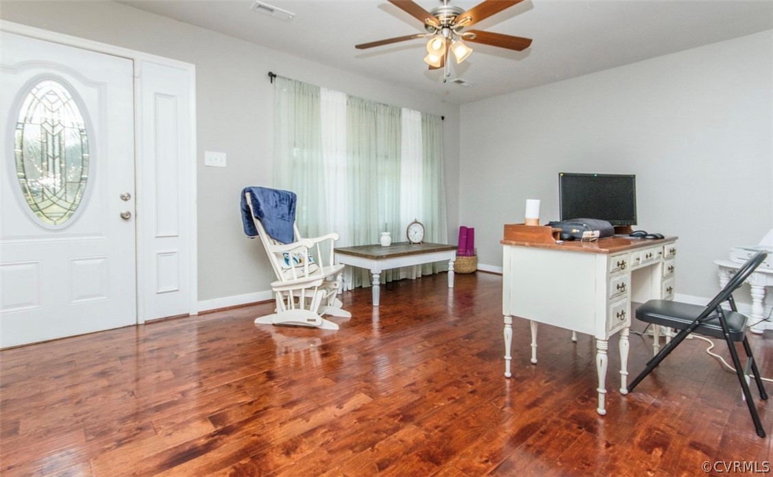 12906 Lewis Road Chesterfield, VA 23831 - Photo 10 of 22 a work room with furniture and wooden floor