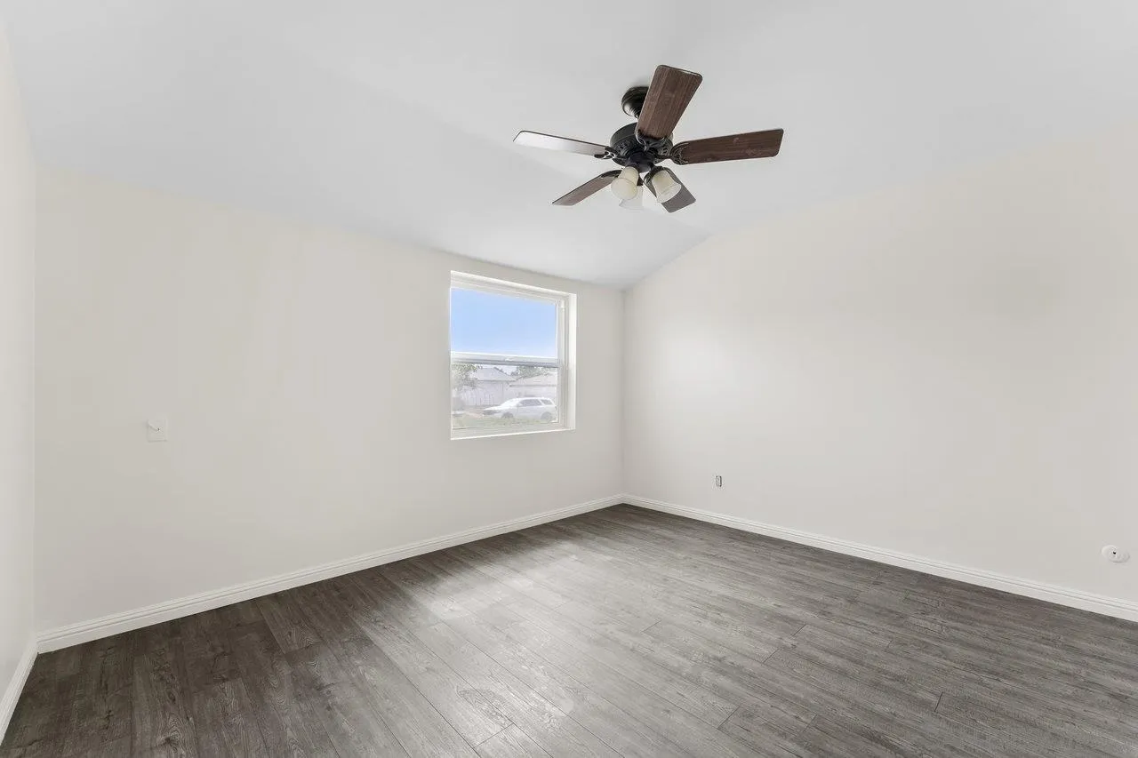 582 Macon Street El Cajon, CA 92019 - Photo 21 of 34 a view of empty room with wooden floor and fan
