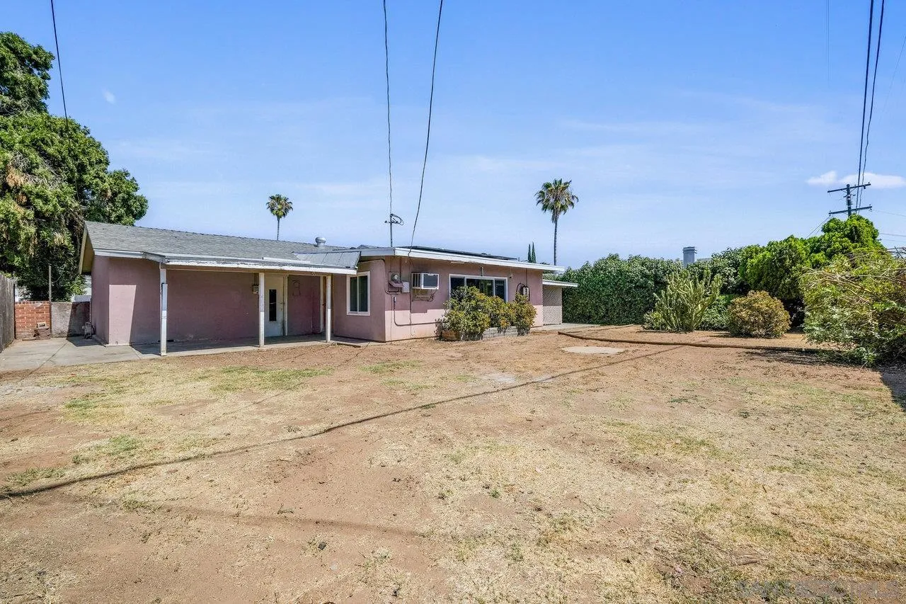 582 Macon Street El Cajon, CA 92019 - Photo 3 of 34 a view of a house with a yard and garage