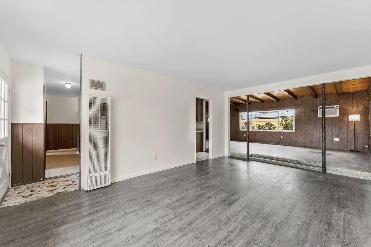 582 Macon Street El Cajon, CA 92019 - Photo 6 of 34 a view of an empty room with wooden floor