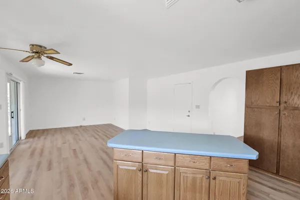 a view of kitchen with cabinets