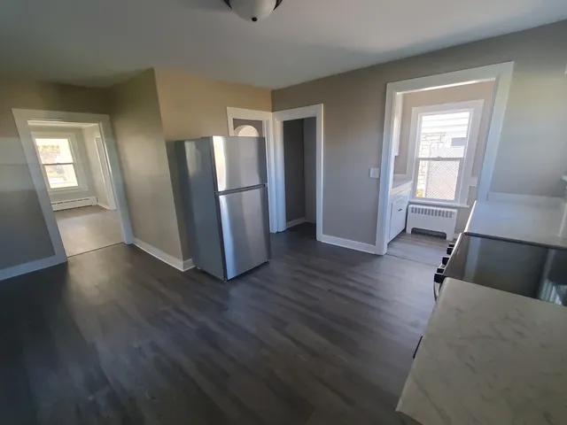 a view of a livingroom with wooden floor