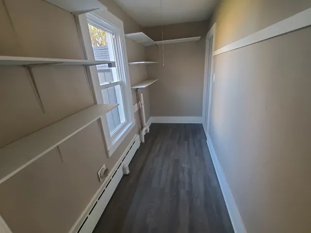 a view of entryway with wooden floor