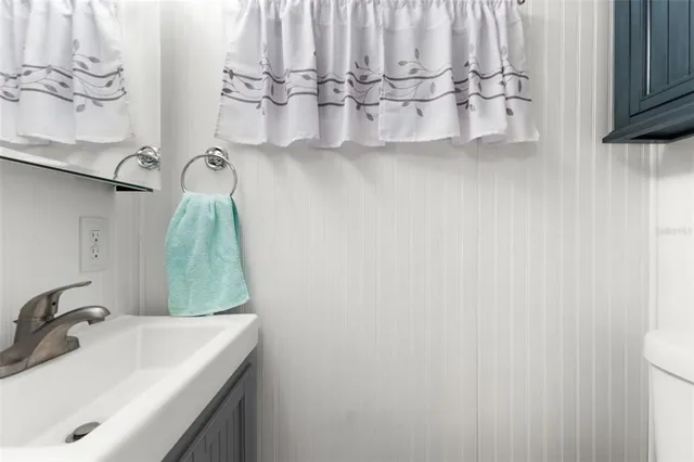 a bathroom with a sink and mirror
