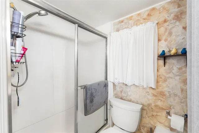 a bathroom with a shower and a sink