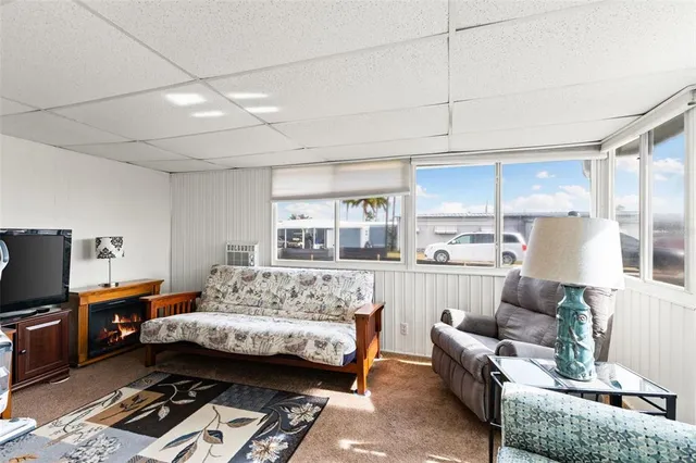 a bedroom with furniture and a wooden floor