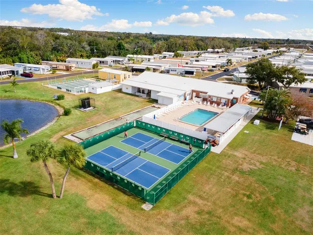 a view of a swimming pool with lounge chairs