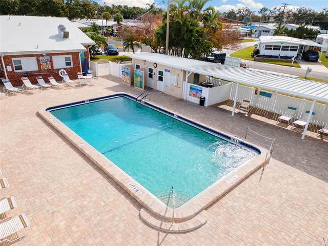 a view of a swimming pool with lounge chairs