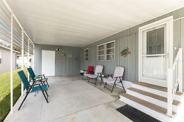 a dining room with furniture and a window