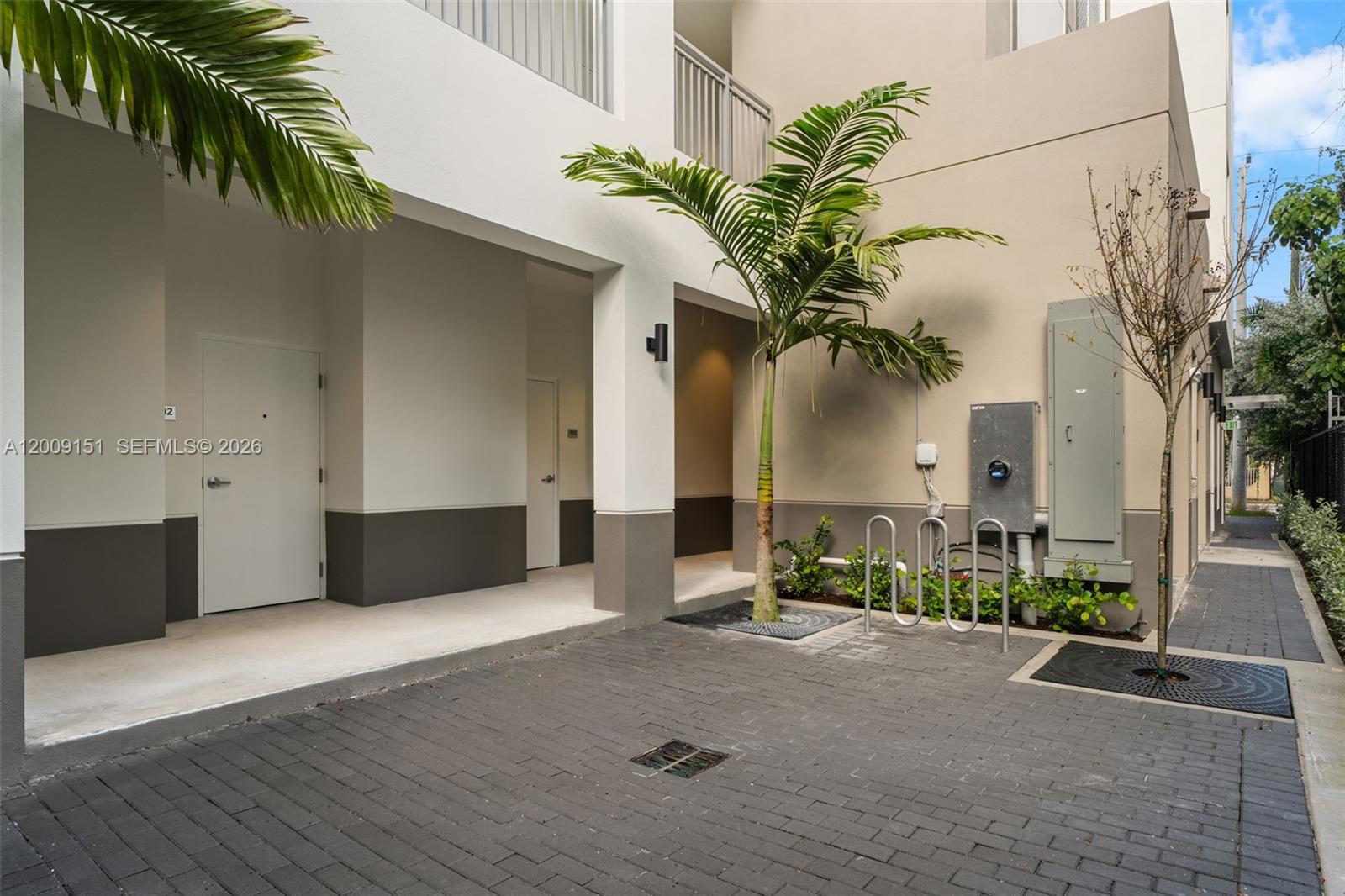 650 Southwest 1st Street, Unit 402 Miami, FL 33130 - Photo 15 of 16 a house with a potted plant in front of it