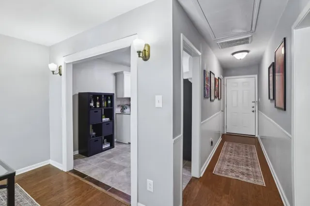 a view of hallway with furniture and a rug