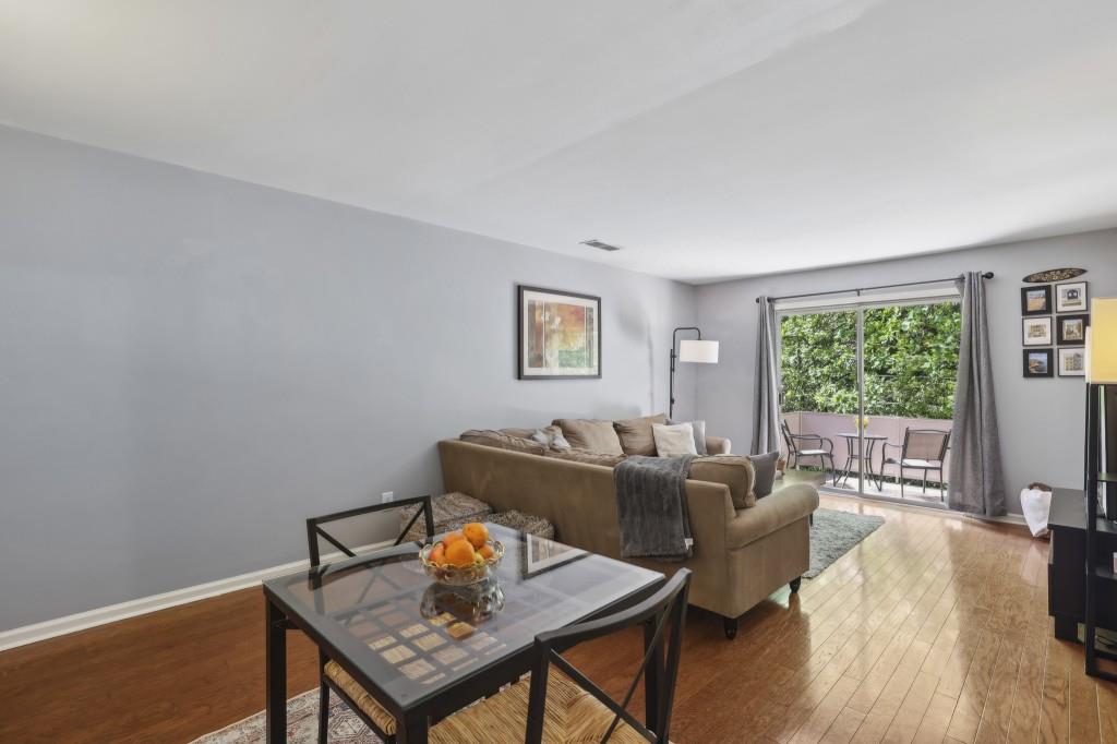 5400 Roswell Road, Unit H5 Atlanta, GA 30342 - Photo 12 of 26 a living room with furniture and a window