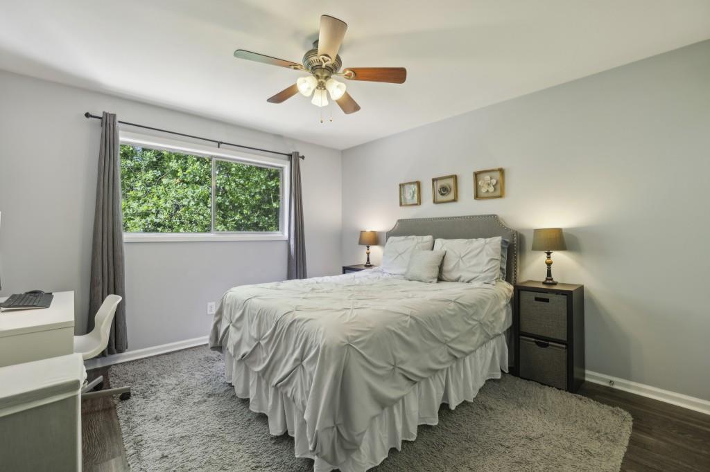 5400 Roswell Road, Unit H5 Atlanta, GA 30342 - Photo 4 of 26 a bedroom with a bed and a window