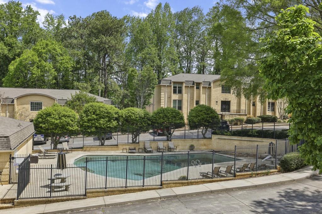 5400 Roswell Road, Unit H5 Atlanta, GA 30342 - Photo 7 of 26 a view of a swimming pool with a patio