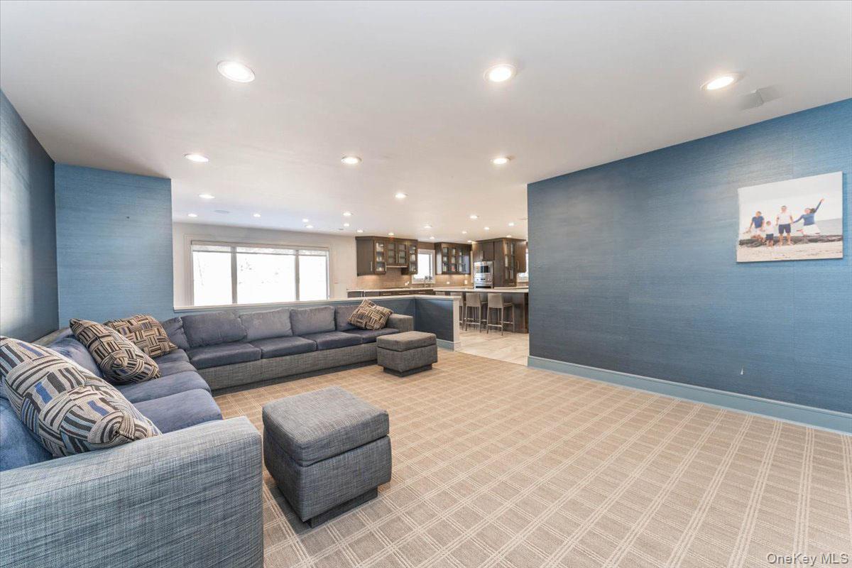 22 Larch Hill Road Lawrence, NY 11559 - Photo 11 of 31 a living room with furniture and view of kitchen