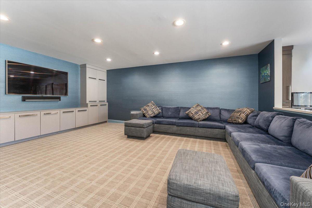 22 Larch Hill Road Lawrence, NY 11559 - Photo 12 of 31 a living room with furniture and a flat screen tv