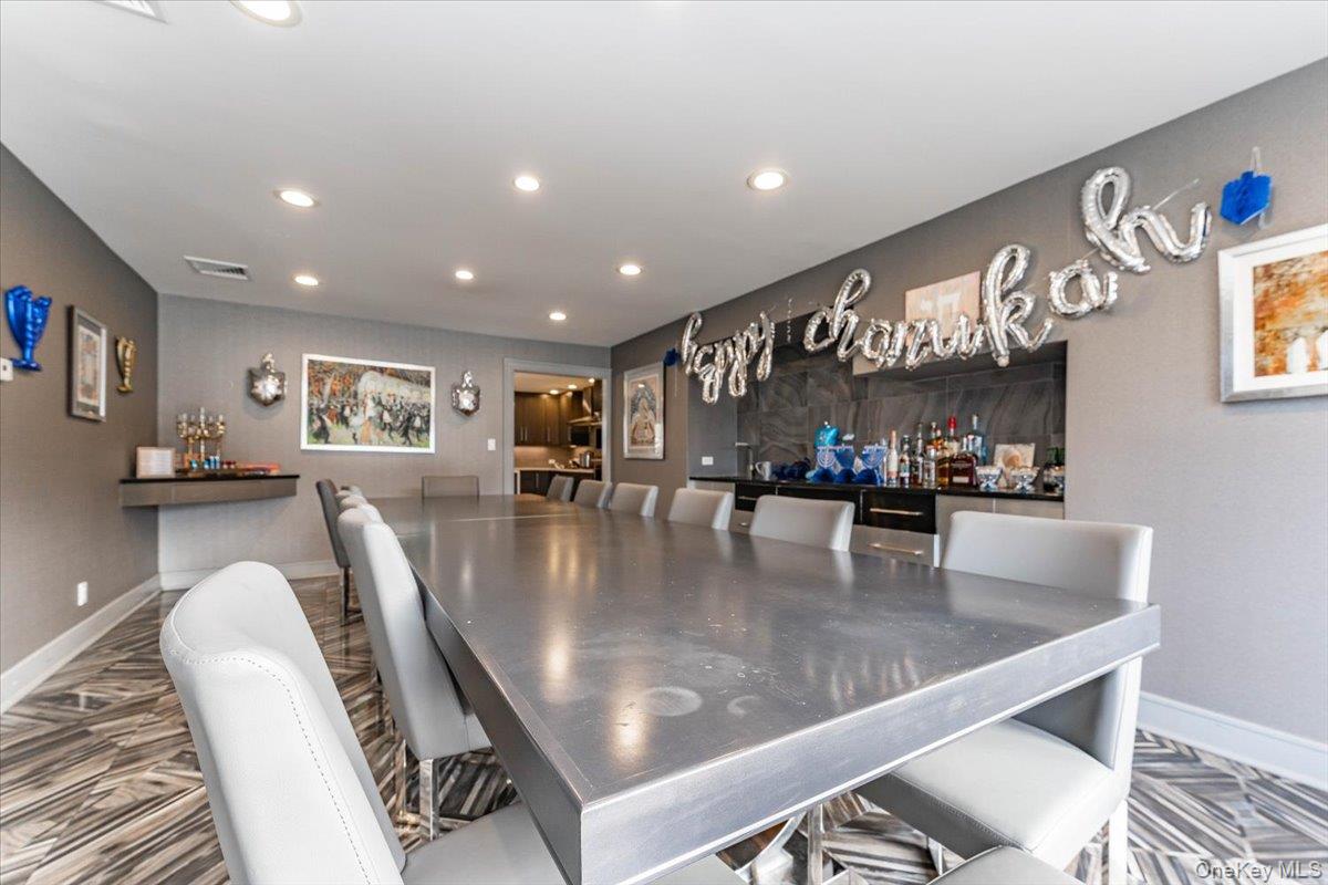 22 Larch Hill Road Lawrence, NY 11559 - Photo 13 of 31 Dining area featuring bar area