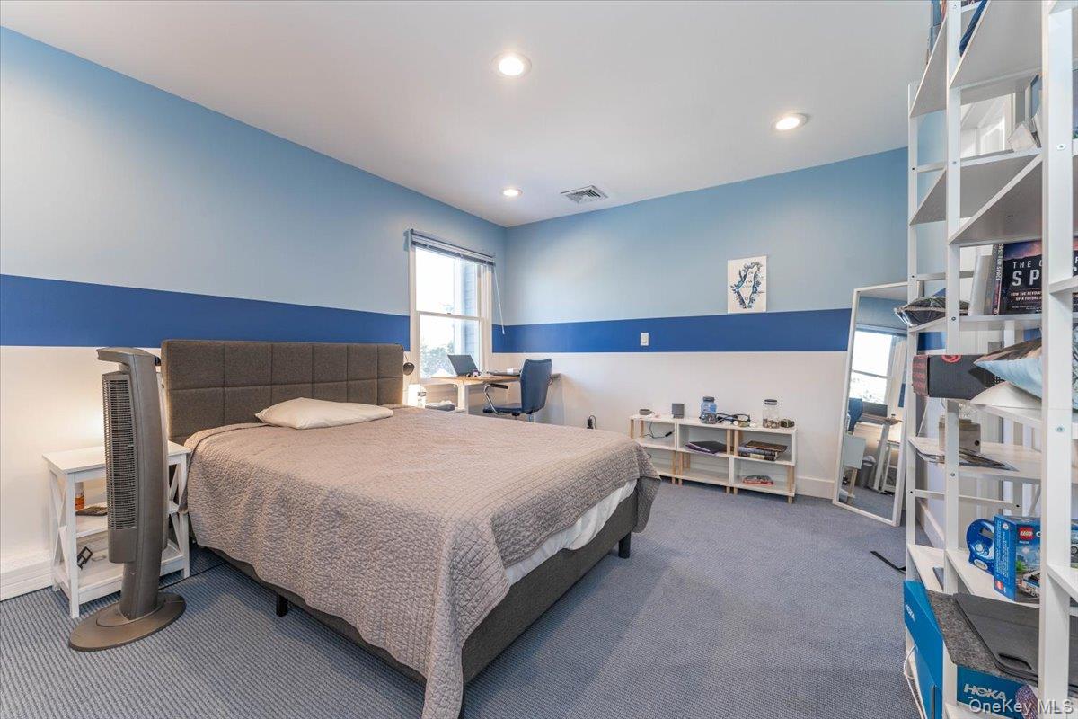 22 Larch Hill Road Lawrence, NY 11559 - Photo 15 of 31 a bed room with bed and window