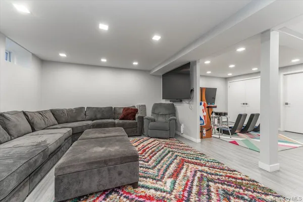 a room with furniture and a flat screen tv