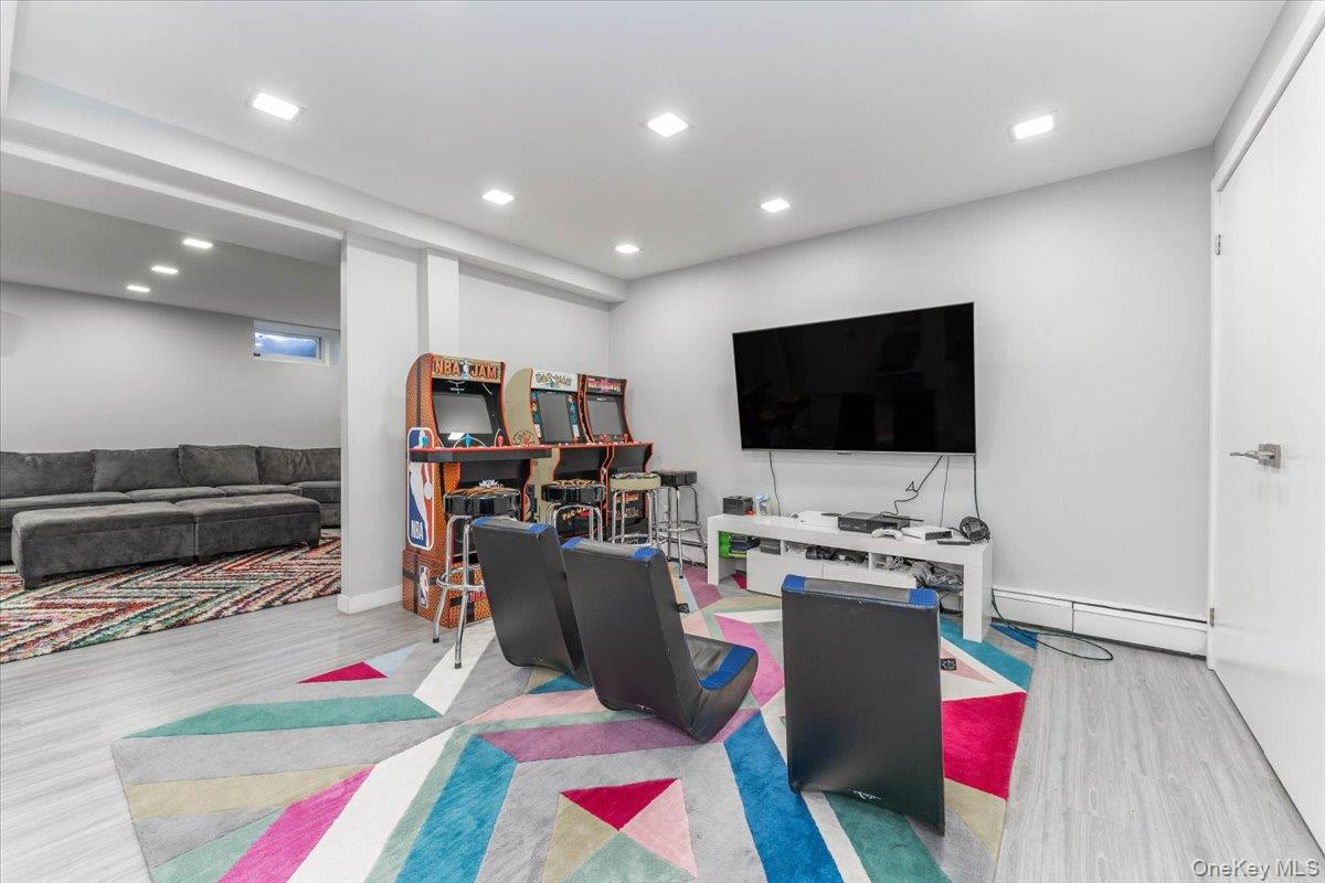 22 Larch Hill Road Lawrence, NY 11559 - Photo 18 of 31 a room with furniture and a flat screen tv
