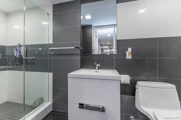 a bathroom with a sink vanity and a mirror